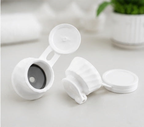 Close-up of inverted bottle cap with flip lid
