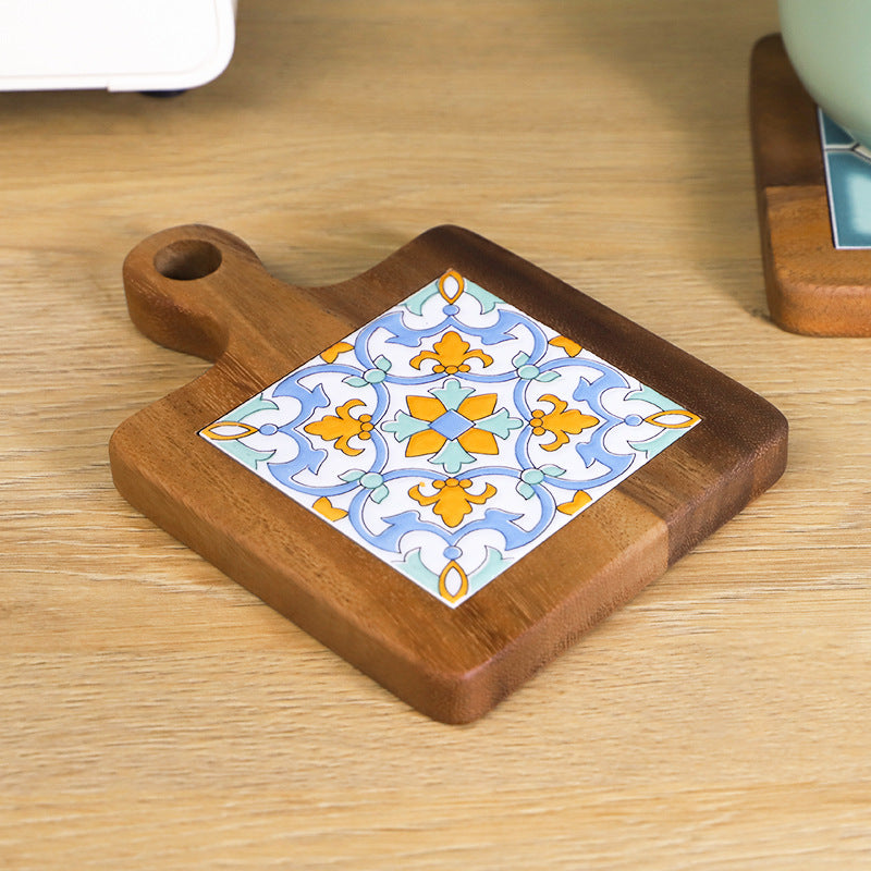 Kitchen scene with Mediterranean patterned wood and ceramic table mat on counter