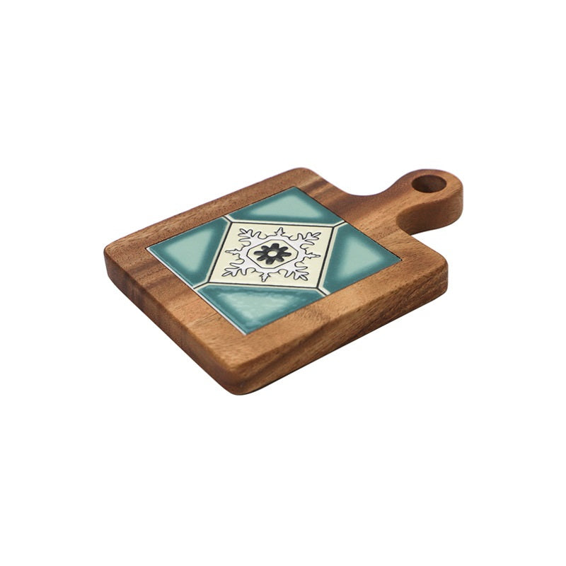Angled image of turquoise and cream tile wooden table mat