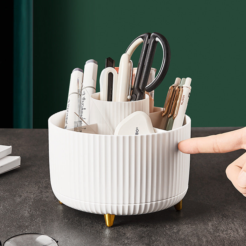 White rotating desk organizer filled with pens, scissors, and office tools for an efficient and clutter-free desk  