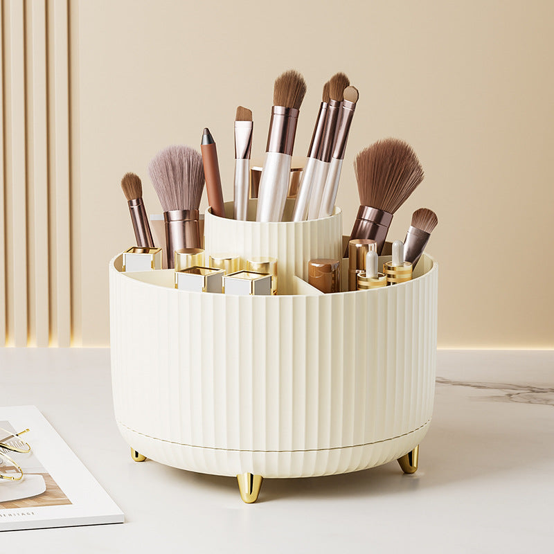 Cream rotating organizer stylishly holding makeup brushes and cosmetics for tidy beauty essentials  